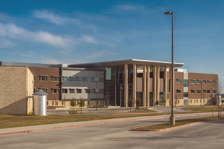 Suburban school campus environment in 78610 Buda, TX